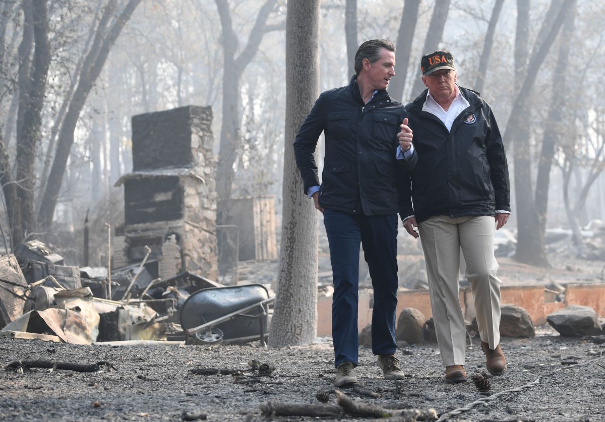 President Donald Trump speaks with Gavin Newson, who was lieutenant governor of California at the time, as they view damage from the Camp fire in Paradise, California, on November 17th, 2018.