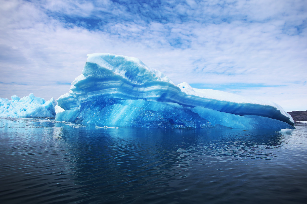 Calved icebergs from the nearby Twin Glaciers are seen floating on the water in Qaqortoq, Greenland.