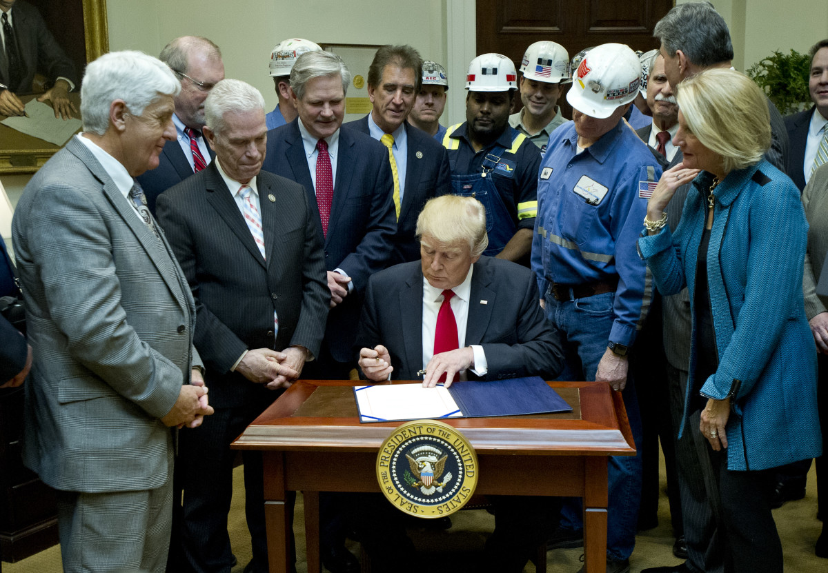 President Donald Trump signs H.J. Res. 38, disapproving the rule submitted by the Department of the Interior known as the Stream Protection Rule in the Roosevelt Room of the White House on February 16th, 2017. The Stream Protection Rule was signed to "address the impacts of surface coal mining operations on surface water, groundwater, and the productivity of mining operation sites."