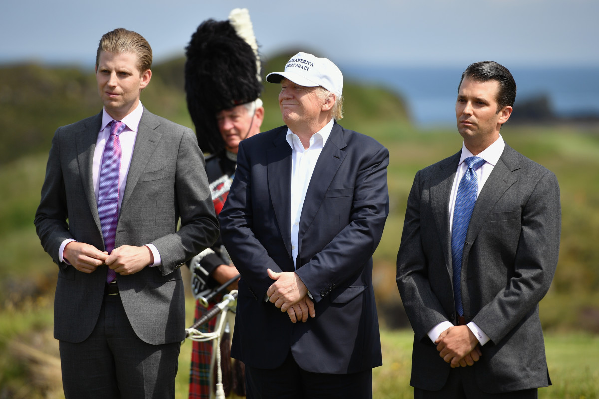 Donald Trump stands with his two sons following a press conference on the 9th tee at his Trump Turnberry Resort on June 24th, 2016, in Ayr, Scotland.