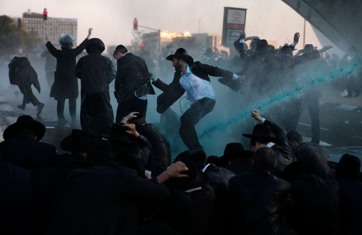 Israeli security forces break up a protest of ultra-Orthodox Jews with water cannons in Jerusalem on October 23rd, 2017. Several thousand ultra-Orthodox Jews blocked the main entrance to Jerusalem as part of a series of demonstrations against serving in the Israeli military.