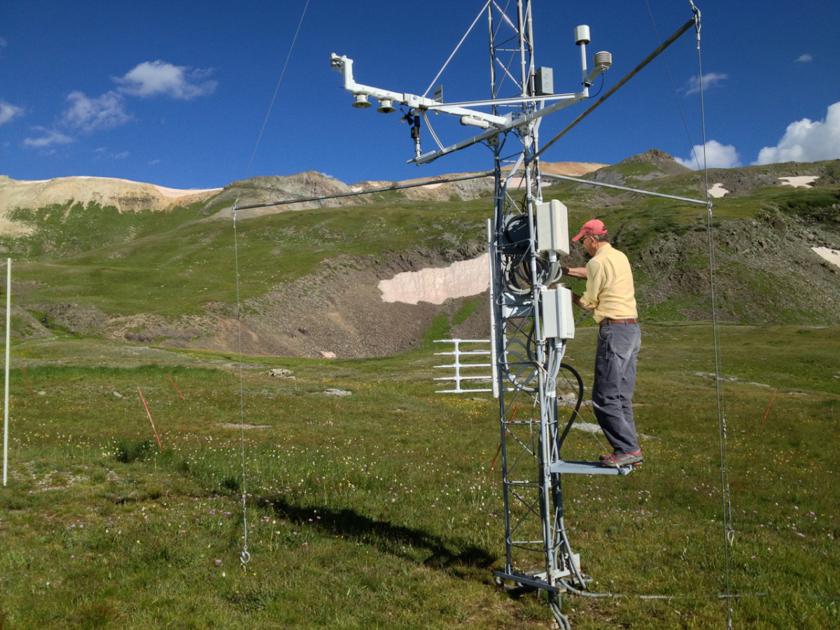 Mountain researcher Chris Landry, former director of the Colorado Center for Snow and Avalanche Studies, checks climate measuring instruments at a research station at 11,000 feet elevation in the San Juan Mountains of Colorado.