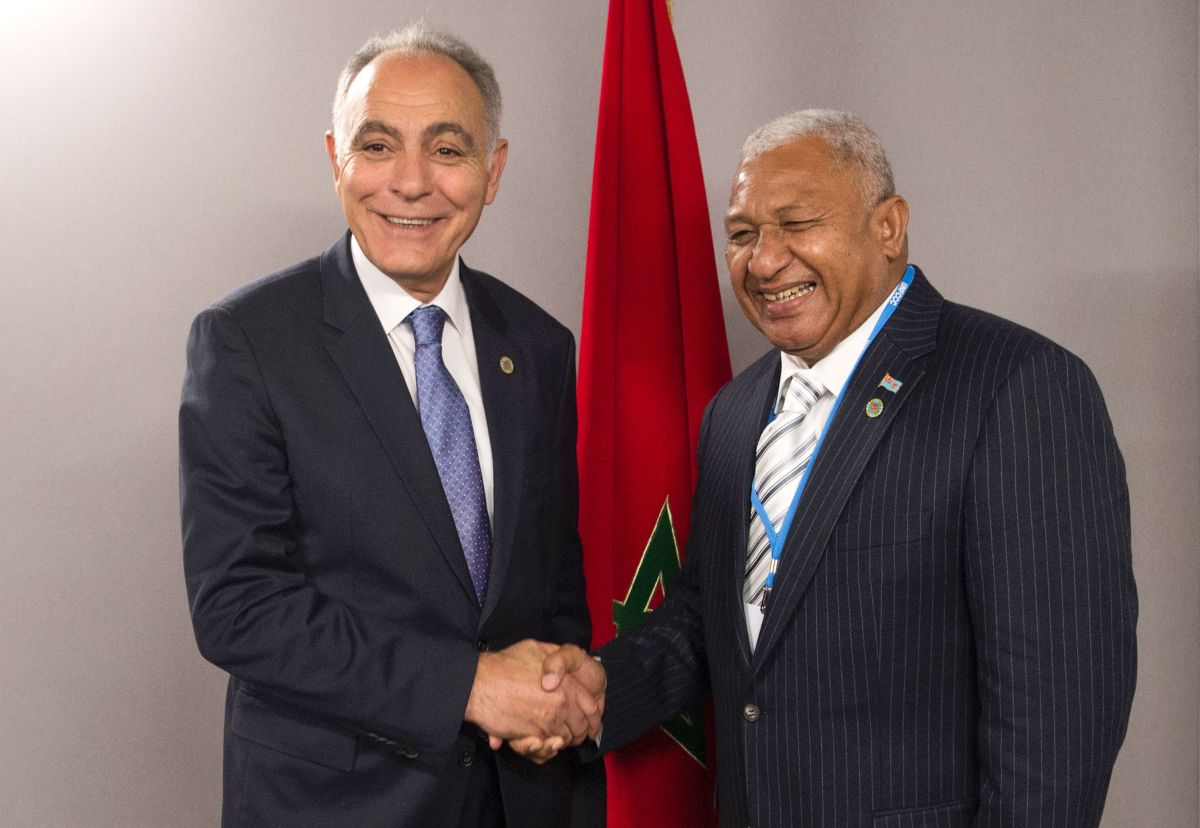 Salaheddine Mezouar (left), the Moroccan minister of foreign affairs, shakes hands with Frank Bainimarama, prime minister of Fiji, at the COP22 climate conference in Marrakech, Morocco, on November 18th, 2016.