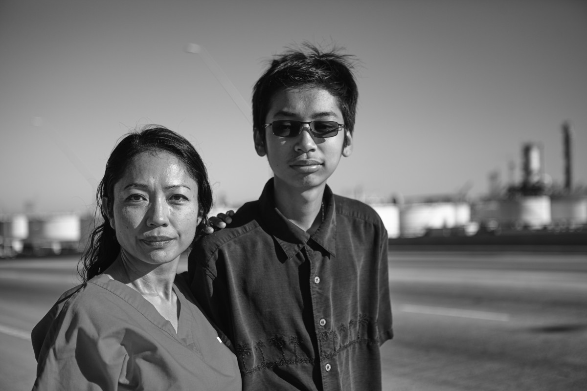 Nurse Pedora Keo and her asthmatic son, Vincent Rol, in the Wilmington neighborhood of Los Angeles. Angry about fossil-fuel pollution in the area, Keo says an asthma attack "could be the end of his life."