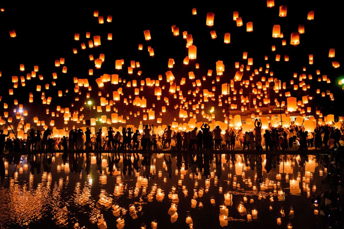A crowd releases lanterns into the air to celebrate the Yee Peng festival, also known as the Festival of Lights, in the city of Chiang Mai in Northern Thailand on November 3rd, 2017.
