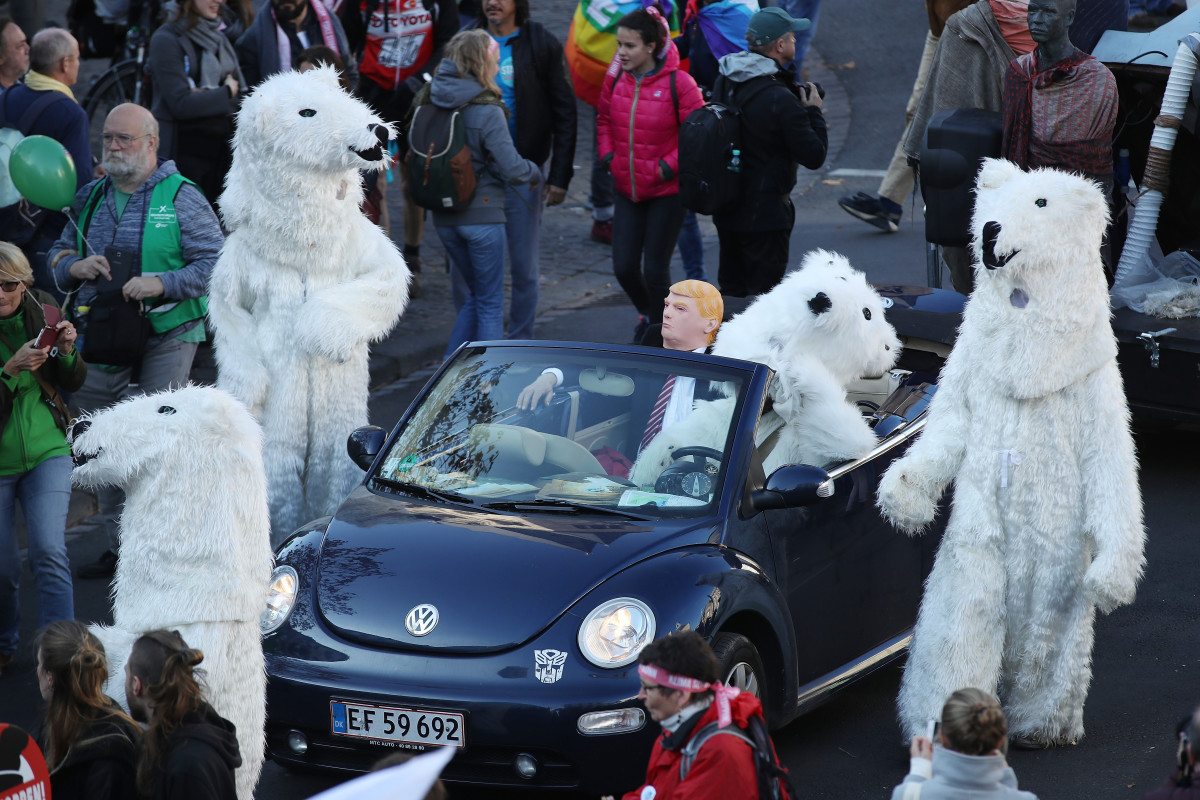 Climate change activists, including one dressed as U.S. President Donald Trump, march to demonstrate against coal energy on November 4th, 2017, in Bonn, Germany.