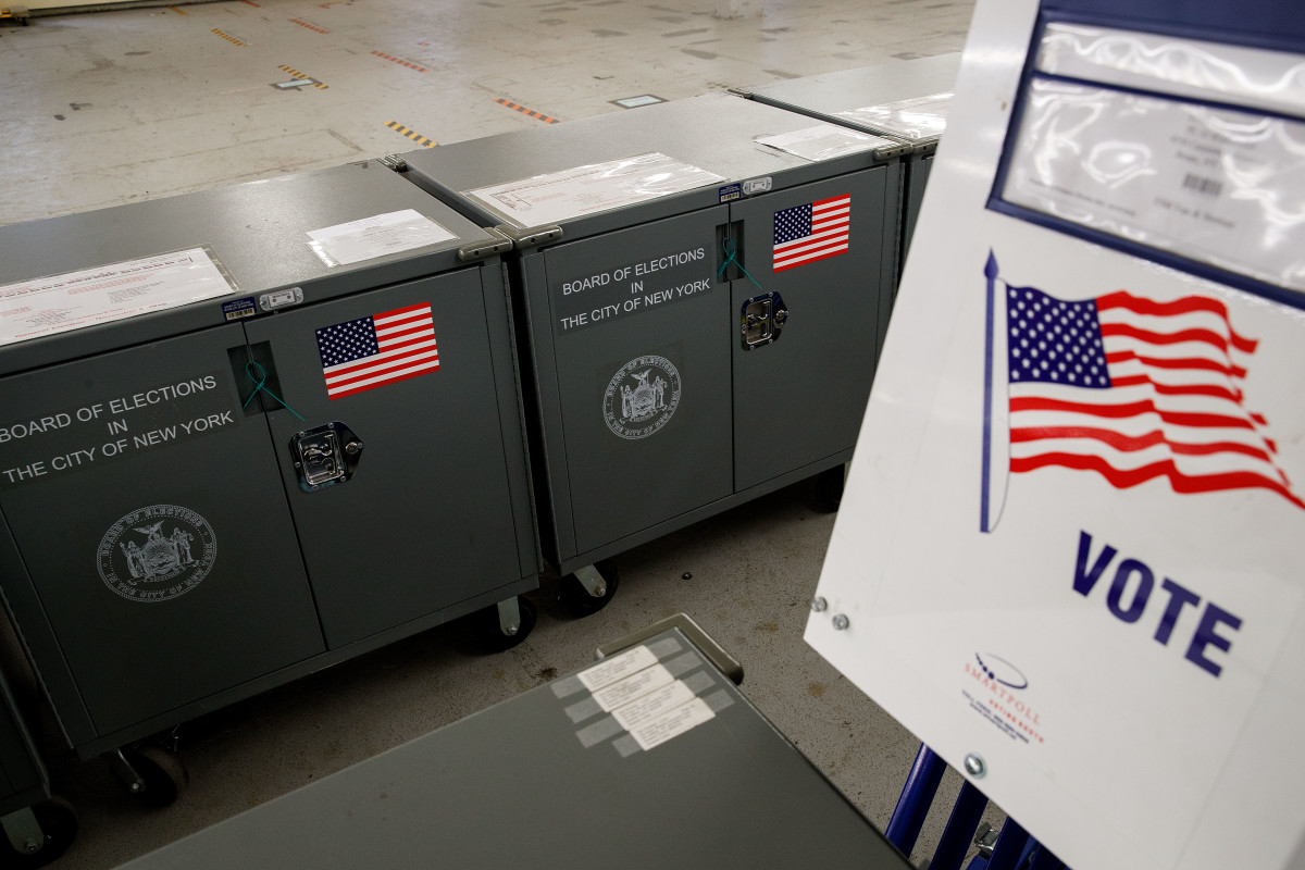 Voting booths and crates containing polling station supplies sit at a New York City Board of Elections voting machine facility warehouse.