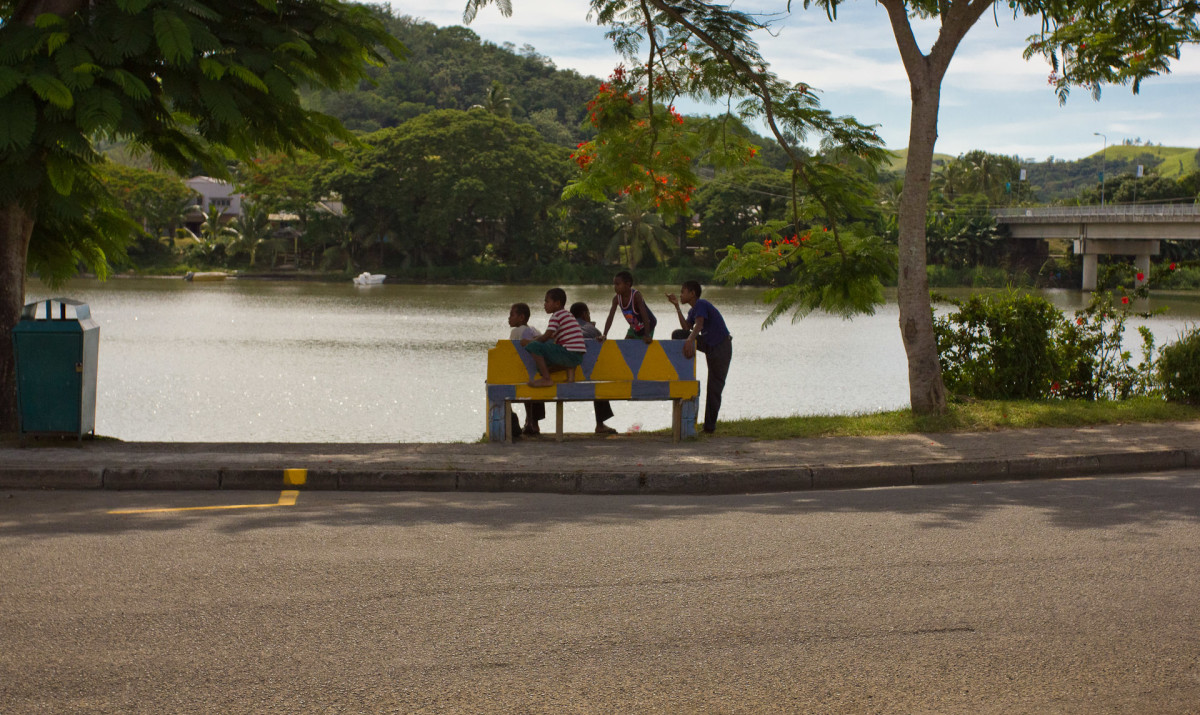 A group of young boys hanging out near the Sigatoka River.