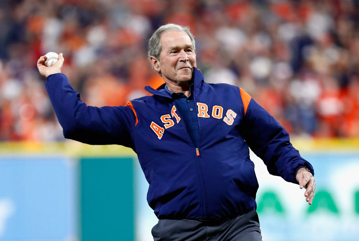 George W. Bush throws out the ceremonial first pitch before game five of the 2017 World Series on October 29th, 2017, in Houston, Texas.