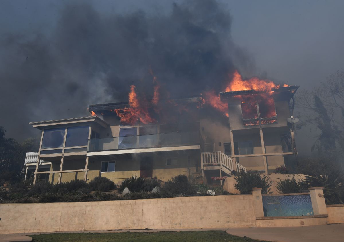A house burns to the ground during the Thomas wildfire in Ventura, California.