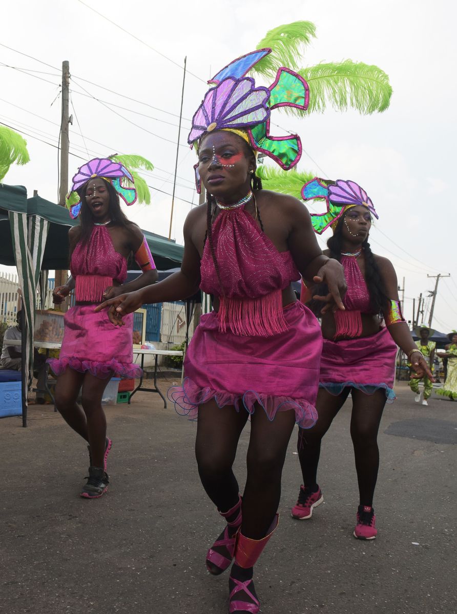 Performers dance during the Lagos Street Carnival on December 3rd, 2017, in Lagos. Commercial activities in the bustling Ikeja district of Lagos were grounded as people danced along the major roads to celebrate the second edition of the Lagos street carnival, heralding the Christmas and New Year's period.