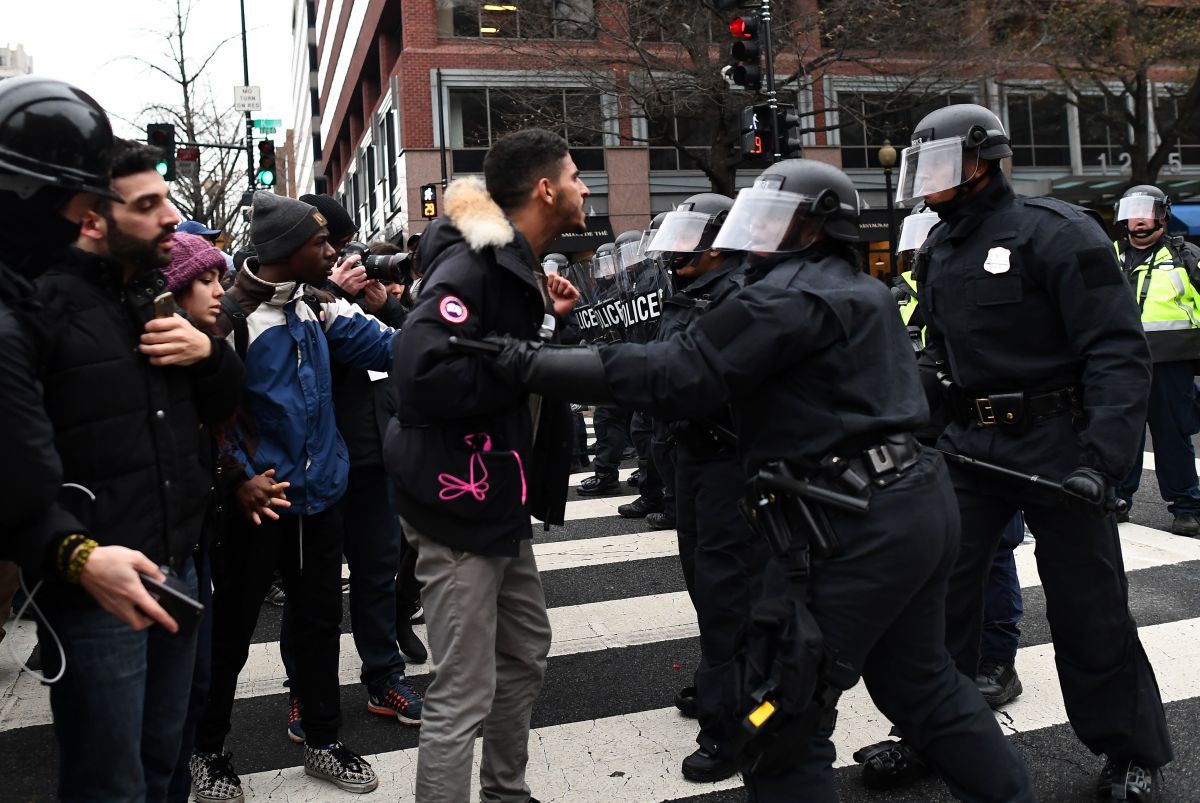 Police officers push back demonstrators as they protest against President Donald Trump in Washington, D.C., on January 20th, 2017.