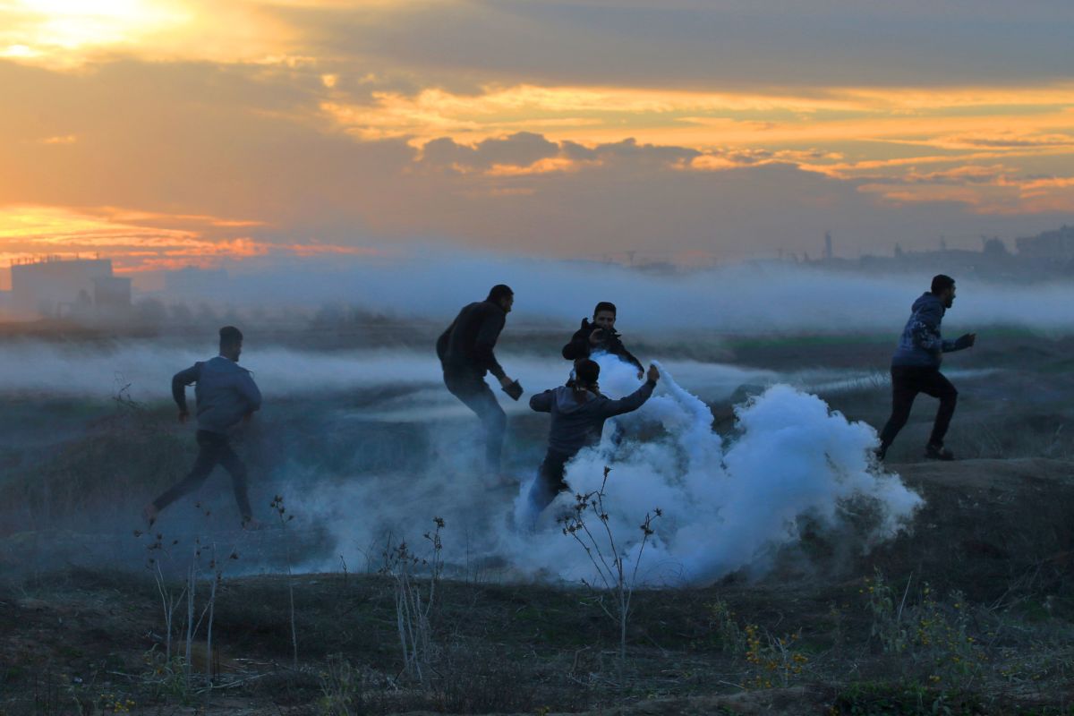 Palestinian protesters clash with Israeli forces on December 11th, 2017, near the border fence with Israel, east of Gaza City.
