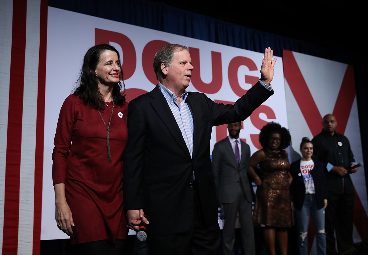 Democratic Senatorial candidate Doug Jones (right) and his wife Louise Jones greet supporters in Birmingham, Alabama, on December 11th, 2017.