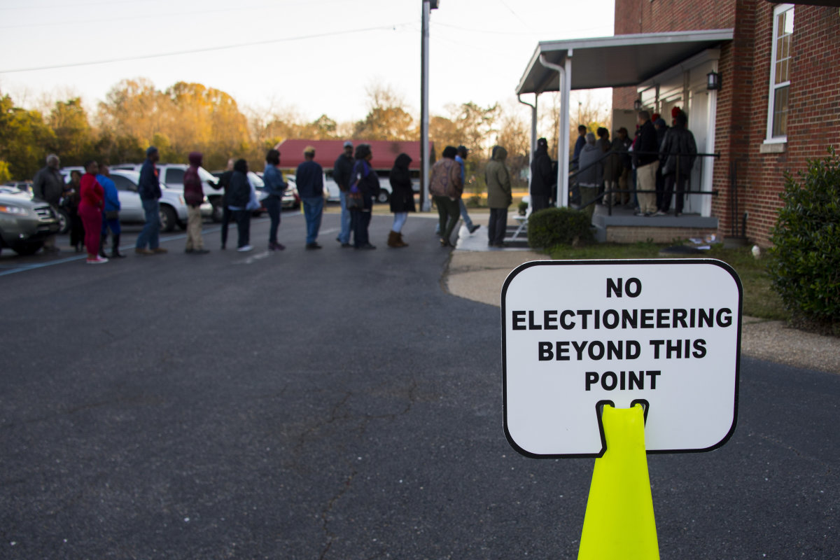 Voters stand in a long line that leads out the door to vote at Beulah Baptist Church polling station in Montgomery, Alabama, on December 12th, 2017.