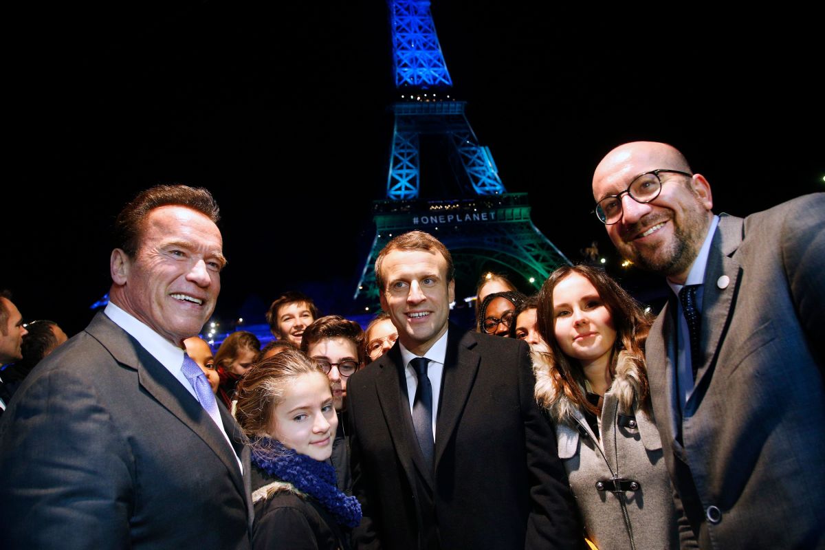 Former Governor of California Arnold Schwarzenegger with French President Emmanuel Macron and Belgian Prime Minister Charles Michel aboard a boat on the River Seine after the One Planet Summit in Paris on December 12th, 2017.