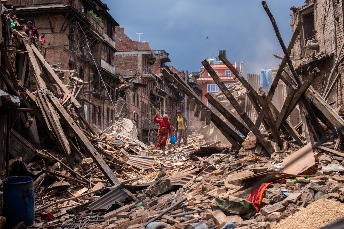 Nepali victims of the earthquake search for their belongings among debris of their homes on April 29th, 2015, in Bhaktapur, Nepal.