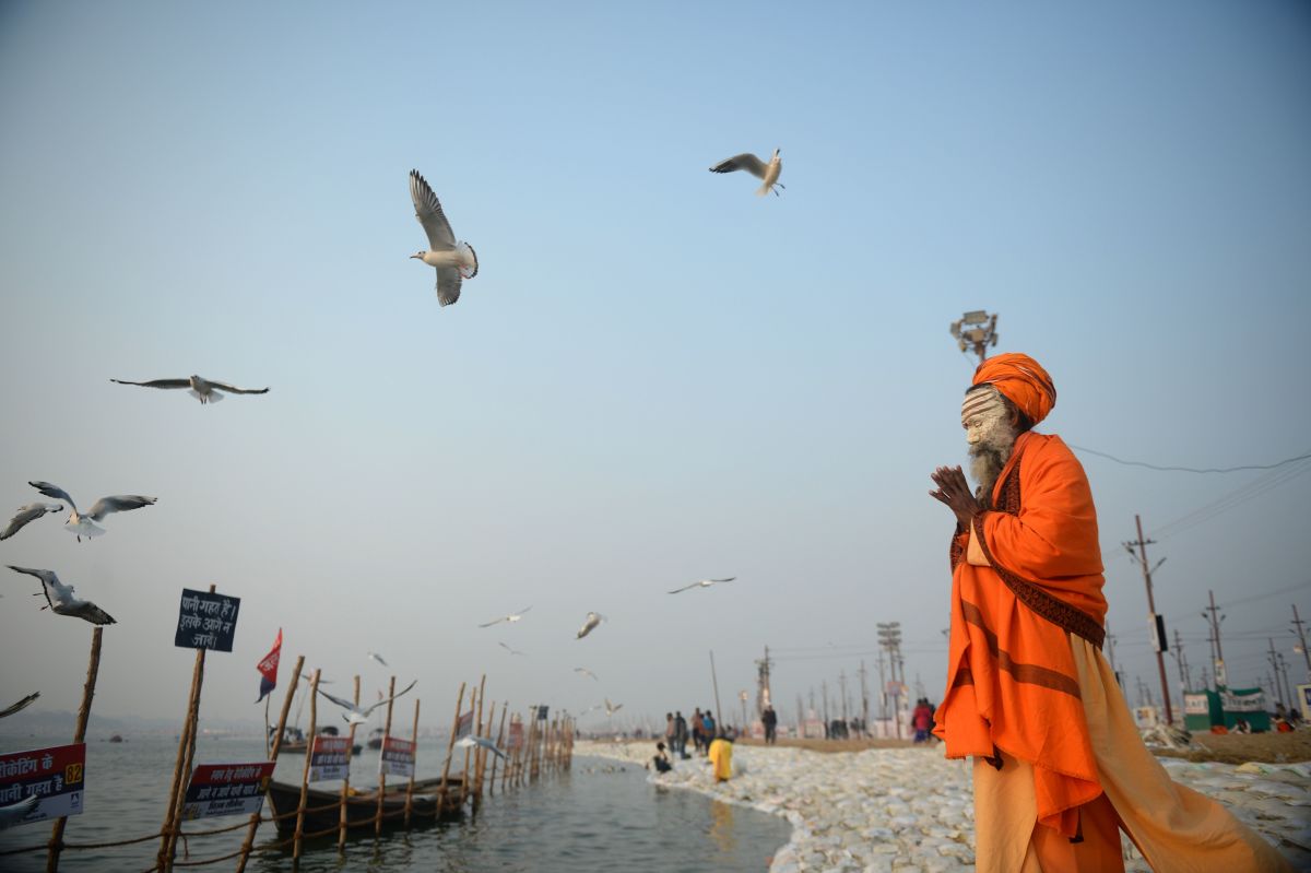 An Indian sadhu performs evening prayer at Sangam during the Magh Mela festival in Allahabad on January 9th, 2018.
