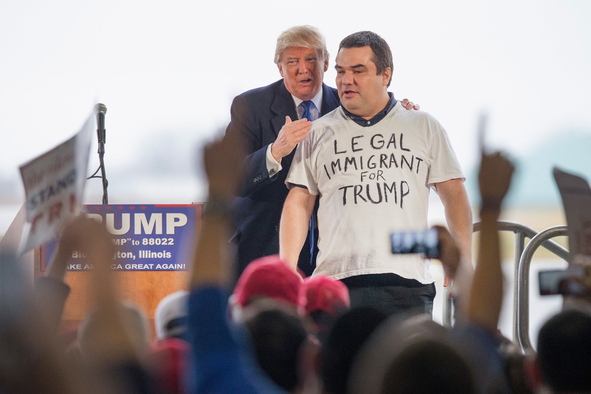 Donald Trump pulls a supporter from a crowd at a rally on March 13th, 2016, in Bloomington, Illinois.