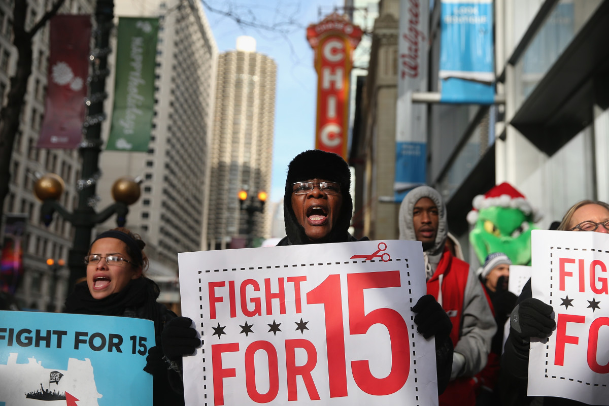Demonstrators demanding an increase in pay for fast-food and retail workers protest in the Loop on December 5th, 2013, in Chicago, Illinois.