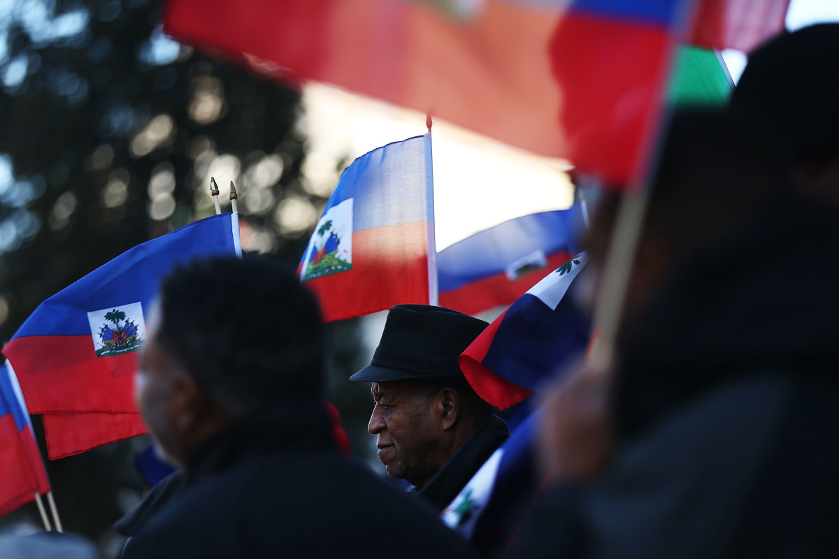 Waving the national flag of Haiti, activists attend a rally in support of immigrants on January 18th, 2018, in Newark, New Jersey.