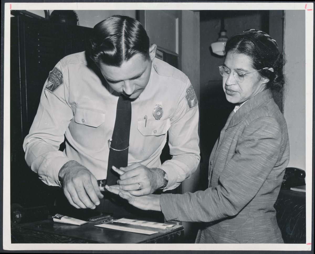 Rosa Parks being fingerprinted by Deputy Sheriff D.H. Lackey after being arrested for boycotting public transportation in Montgomery, Alabama, in February of 1956.