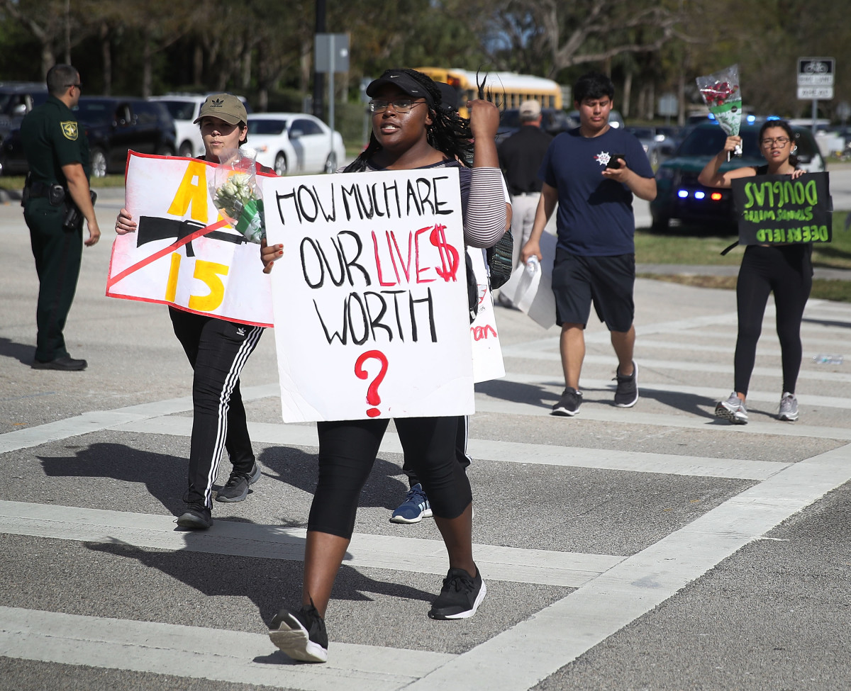 Students arrive at Marjory Stoneman Douglas High School after marching from Deerfield Beach High School on February 23rd, 2018, in Parkland, Florida.