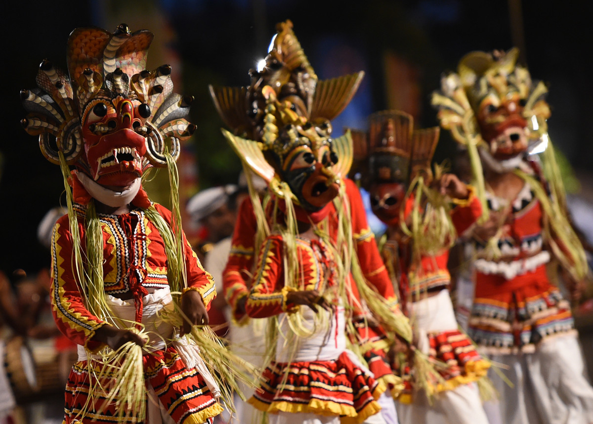 Traditional Kandyan dancers perform during a procession in front of the Gangarama Temple in Colombo, Sri Lanka, on March 1st, 2018, during the Navam Perahera Festival, the city's biggest two-day annual Buddhist procession.