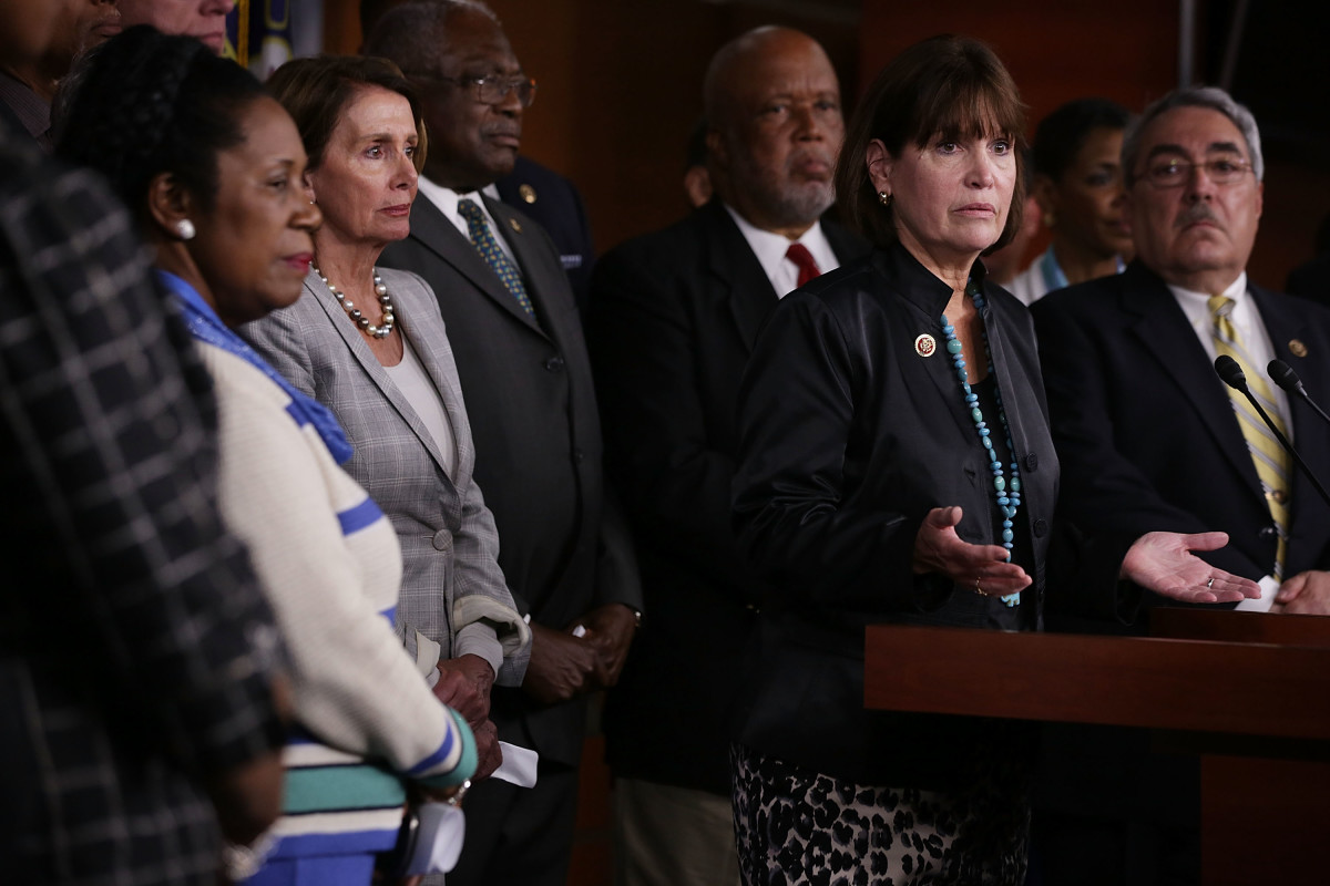 Flanked by other House Democrats, U.S. Representative Betty McCollum, center, speaks as House Minority Leader Nancy Pelosi listens during a news conference about the Confederate flag on July 9th, 2015, in Washington, D.C.