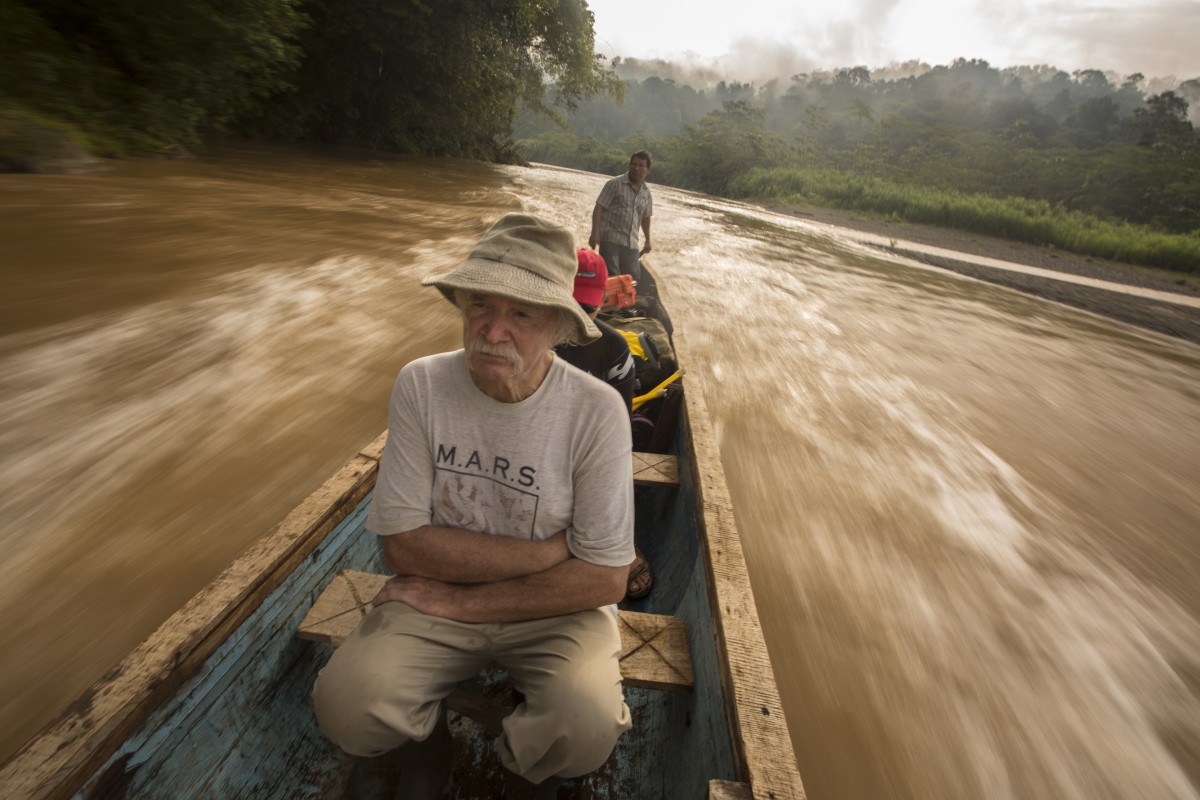 Bill McLarney, Maribel Mafla, and a Bribri guide travel up the Rio Yorkin by motorized canoe.