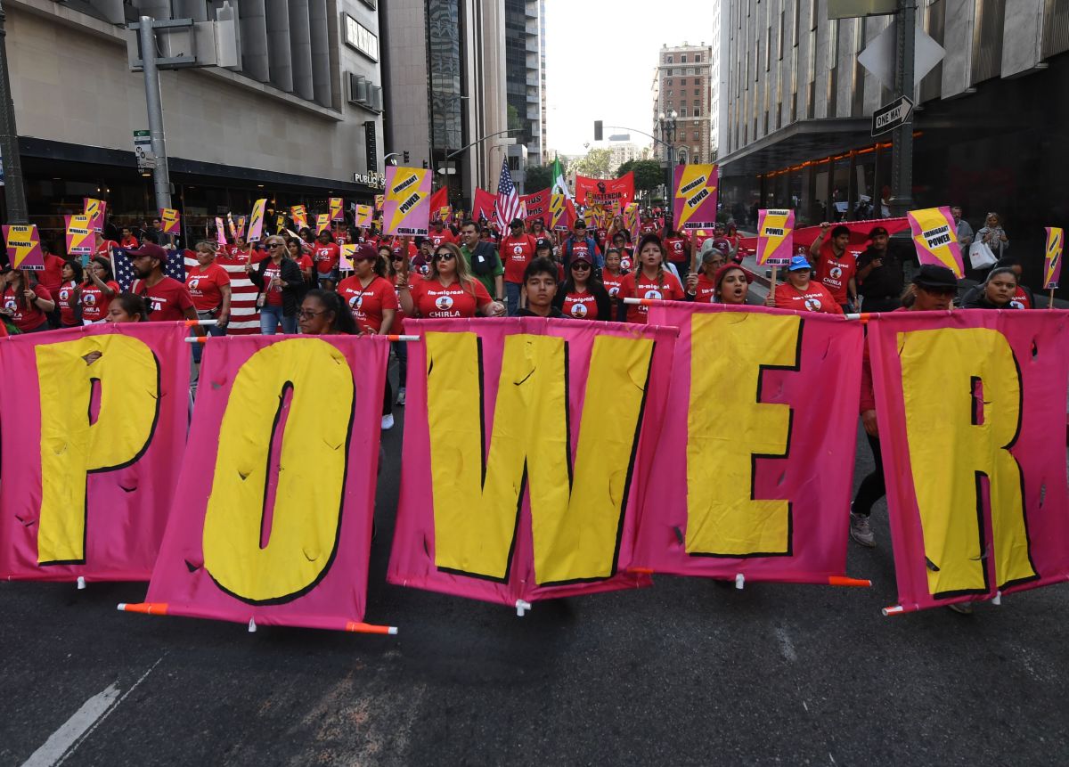 Union members, activists, and their supporters march through Los Angeles during their annual May Day procession in support of workers' rights and immigrant freedom on May 1st, 2019.