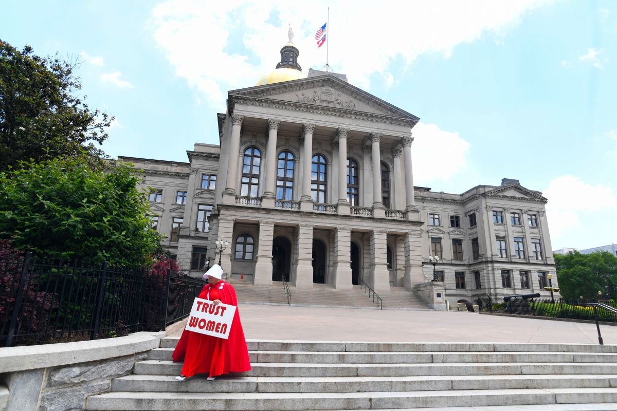 Activist Tamara Stevens with the Handmaids Coalition of Georgia leaves the Georgia Capitol after Democratic presidential candidate Senator Kirsten Gillibrand addressed an event to speak out against the recently passed "heartbeat" bill on May 16th, 2019, in Atlanta, Georgia.