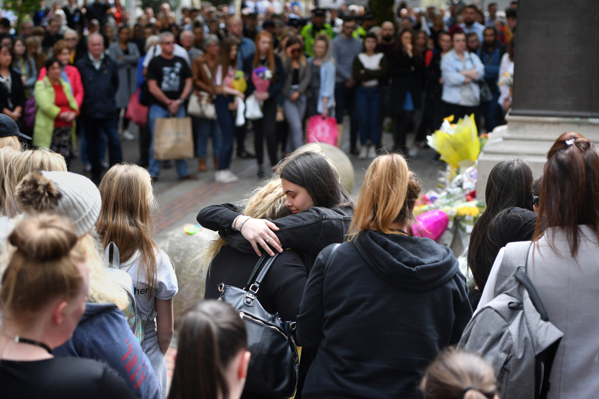 Two women hug while a two-minute silence is observed in memory of the victims of the Manchester Arena Bombing in Saint Anne's Square on May 22nd, 2019, in Manchester, England. The suicide bomb attack took place following a concert at Manchester Arena by singer Ariana Grande and claimed the lives of 22 people.