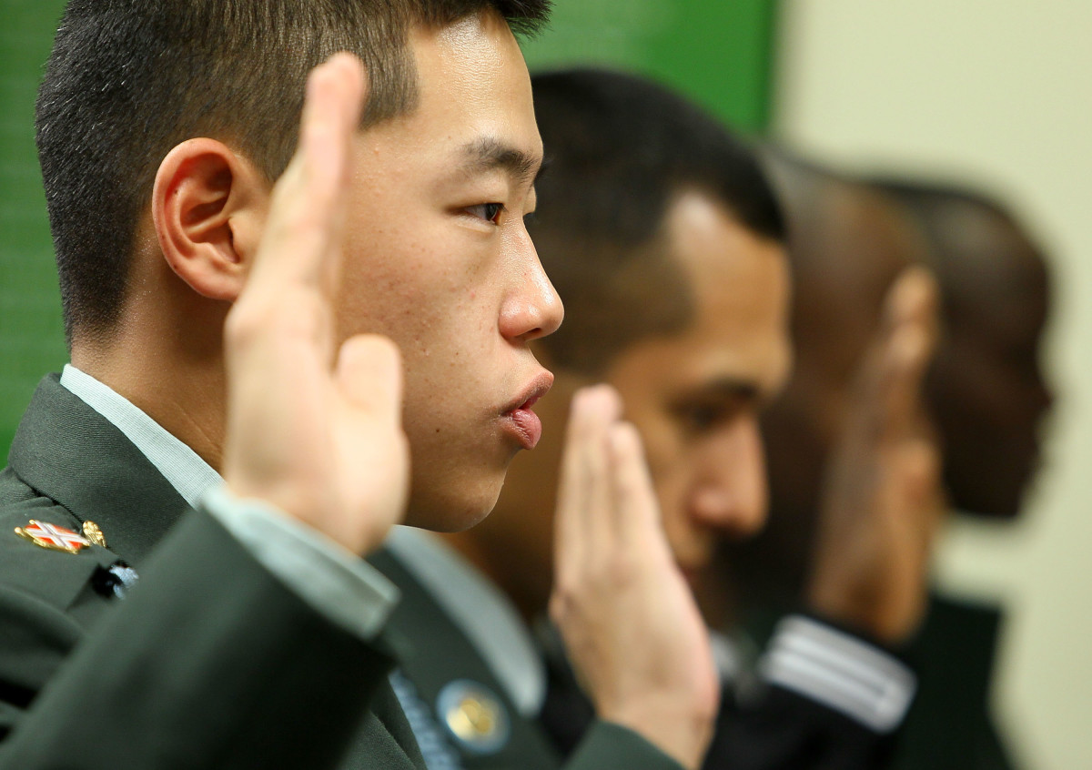 U.S. Army Private First Class Sung Kuyn Chang is sworn in with other members of the armed forces to become new U.S. citizens during a 2010 naturalization ceremony at the U.S. Citizenship and Immigration Services office in Fairfax, Virginia.