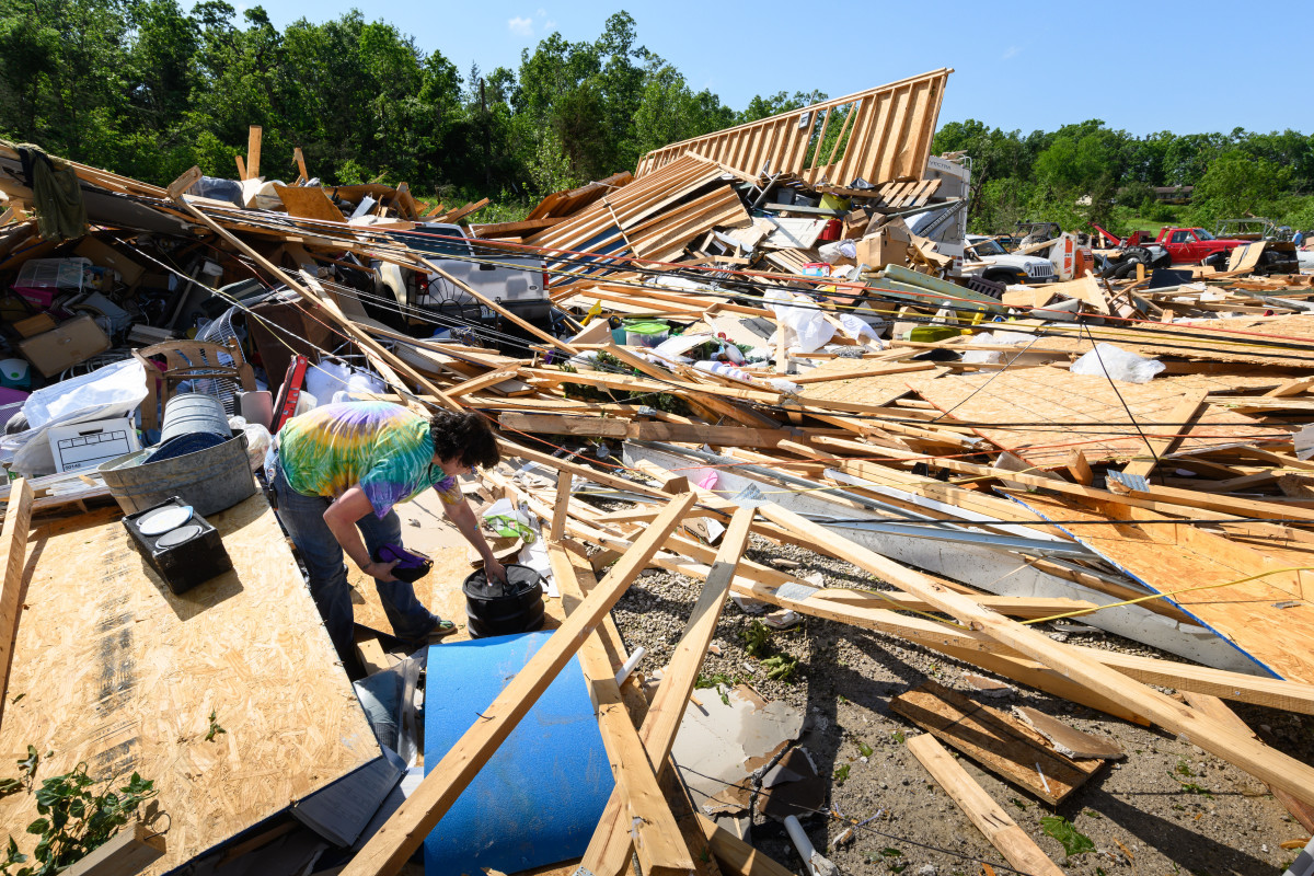 Dee Raithel sorts through the remains of a storage unit looking for her possessions, on May 23rd, 2019, in Jefferson City, Missouri, after a tornado hit the area late Thursday night.