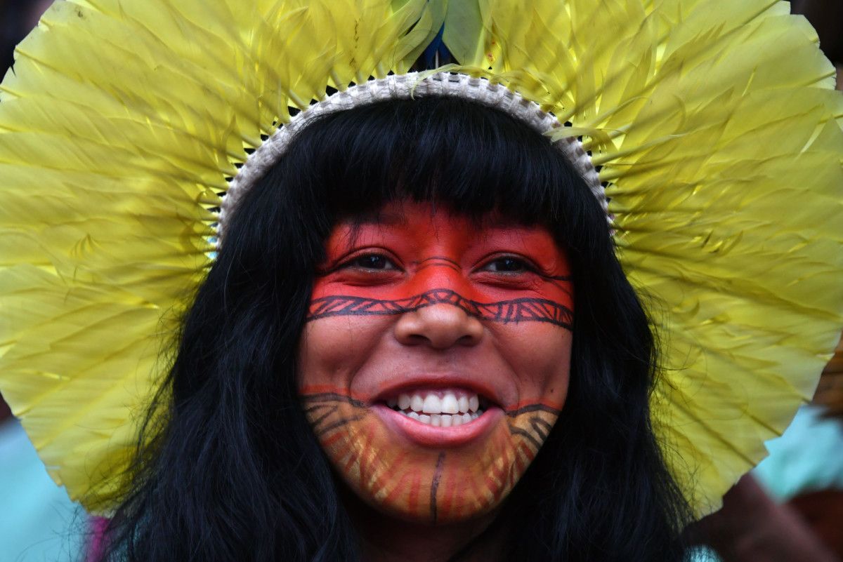 A Brazilian indigenous young woman marches along Paulista Avenue during the commemoration of the International Women's Day in Sao Paulo, Brazil.