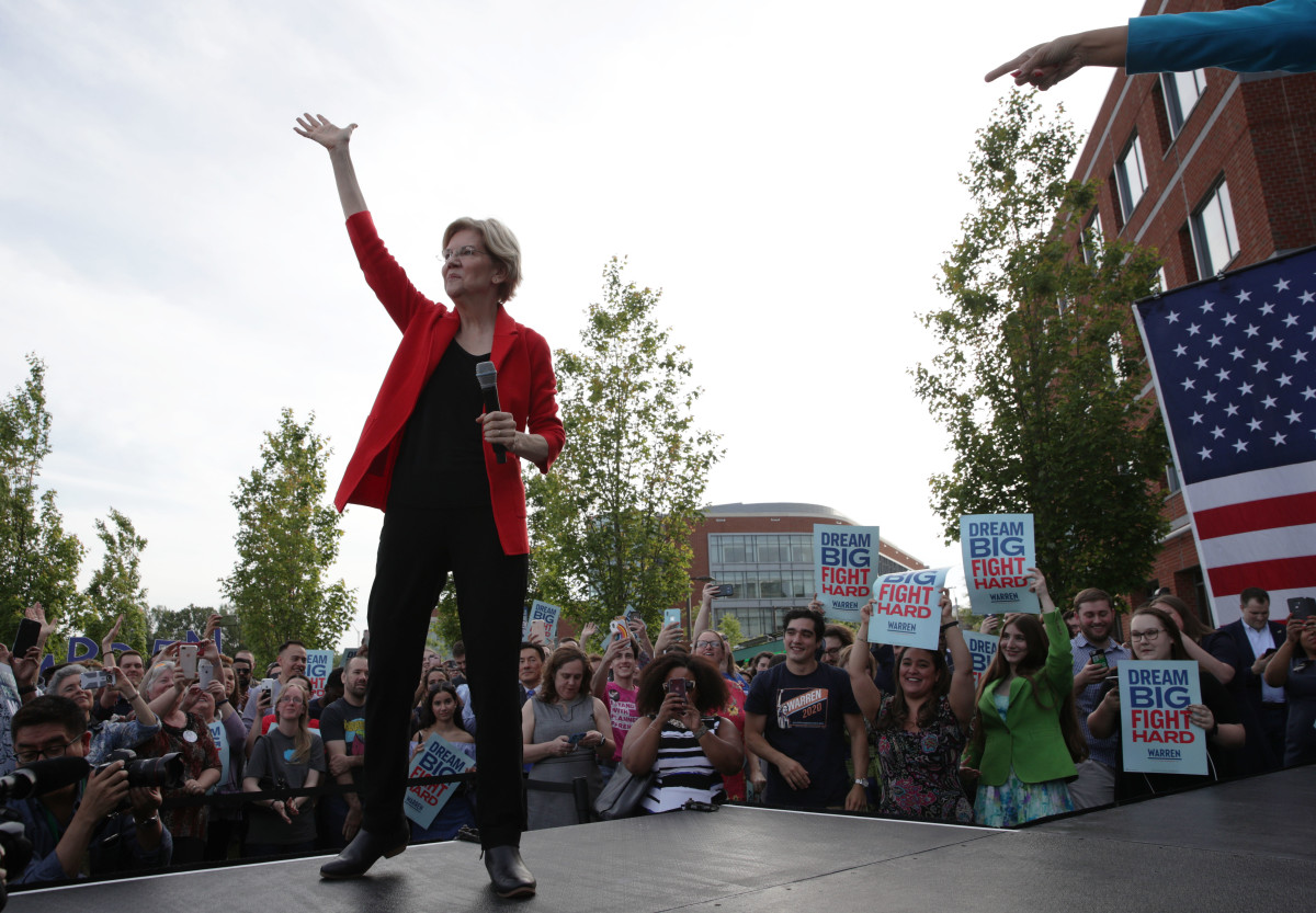 Democratic presidential hopeful Senator Elizabeth Warren waves during a campaign town hall at George Mason University on May 16th, 2019, in Fairfax, Virginia.