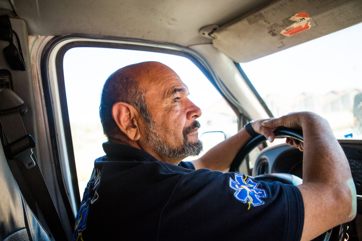 Francisco Olachea, who's known as Pancho or Panchito in the community, uses an old ambulance as his mobile health-care station, transporting medical supplies to refugee shelters where families are waiting with their asylum numbers.