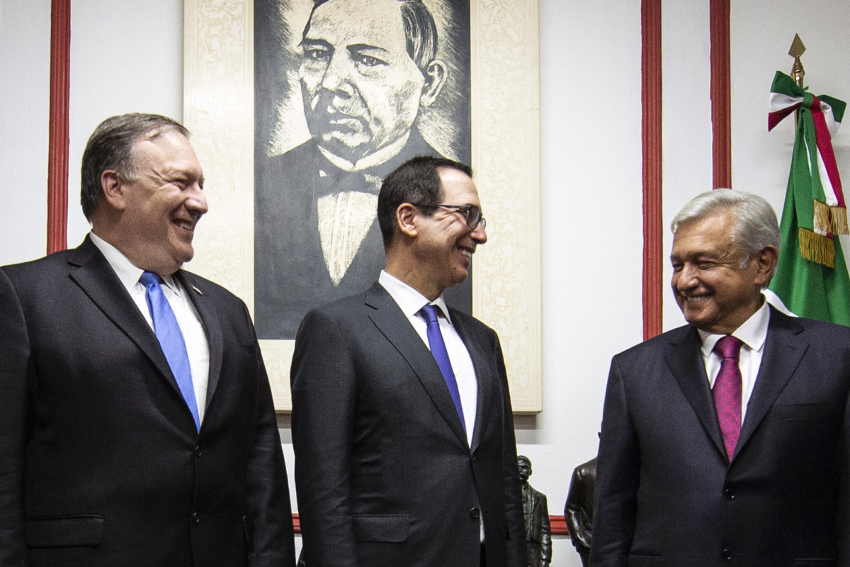 U.S. Secretary of State Mike Pompeo and Secretary of the Treasury Steven Mnuchin speak with then-President-elect of Mexico Andres Manuel Lopez Obrador in July of 2018.