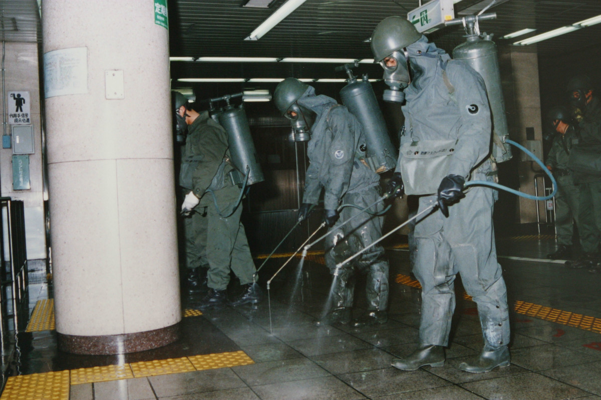 In this handout from the Japanese Defense Agency, personnel are seen clearing sarin off platforms after the 1995 gas attack on Tokyo's subways.