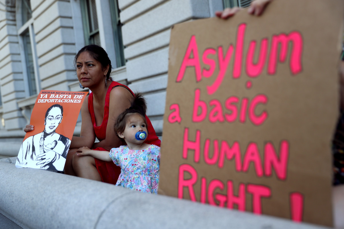 A protester holds a sign during a demonstration outside of the James R. Browning United States Courthouse on June 11th, 2019, in San Francisco, California. Dozens of activists staged a demonstration in support of restoring protections for asylum seekers.