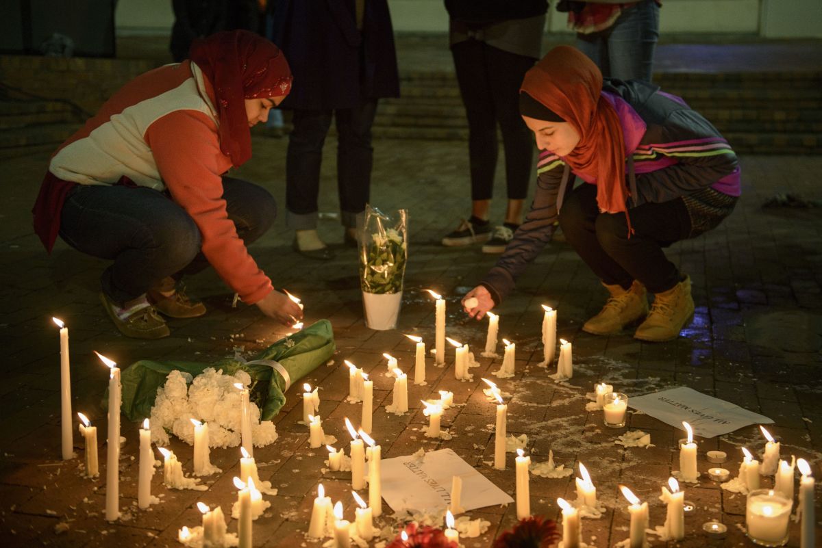 A makeshift memorial is made on February 11th, 2015 in Chapel Hill, North Carolina, after a vigil at the University of North Carolina following the murders of three Muslim students. Craig Stephen Hicks, who perpetrated the killings, was sentenced on three counts of first degree murder in June of 2019.