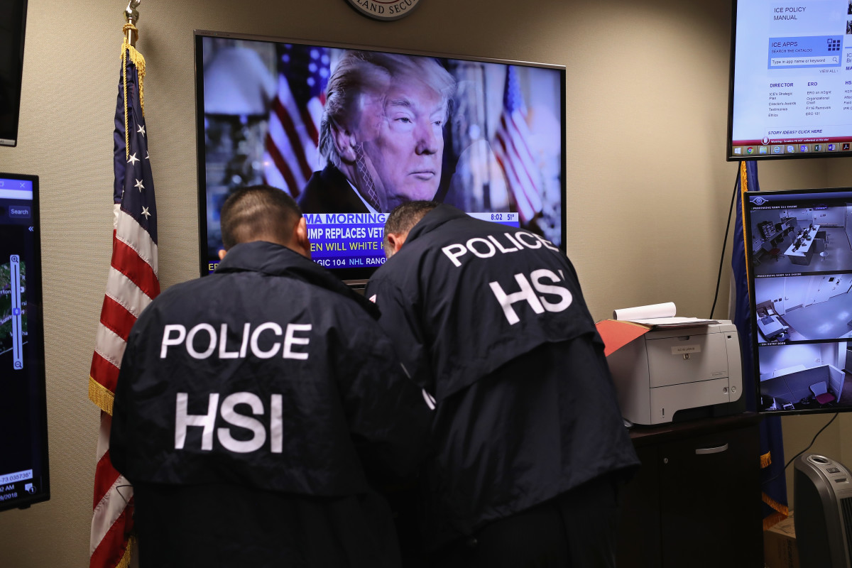 Homeland Security Investigations ICE agents work in a control center.