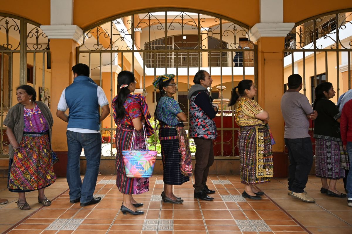 Locals line up to vote at a polling station in San Pedro Sacatepuez, Guatemala, on June 16th, during general elections. Corruption-weary Guatemalans were set to elect a new president Sunday after a tumultuous campaign that saw two leading candidates barred from taking part and the top electoral crimes prosecutor forced to flee the country, fearing for his life.