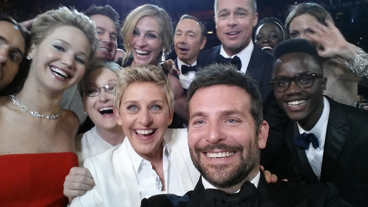 Ellen DeGeneres poses for a selfie taken by Bradley Cooper with (clockwise from L-R) Jared Leto, Jennifer Lawrence, Channing Tatum, Meryl Streep, Julia Roberts, Kevin Spacey, Brad Pitt, Lupita Nyong'o, Angelina Jolie, Peter Nyong'o Jr., and Bradley Cooper during the 86th Annual Academy Awards at the Dolby Theatre on March 2nd, 2014.
