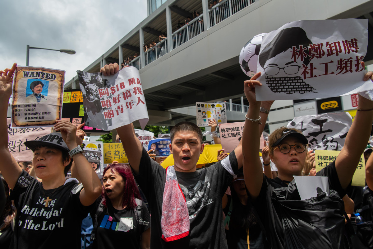 Social workers gather outside the legislative council building to participate in an anti-government march in Hong Kong on July 21st, 2019, in Hong Kong.