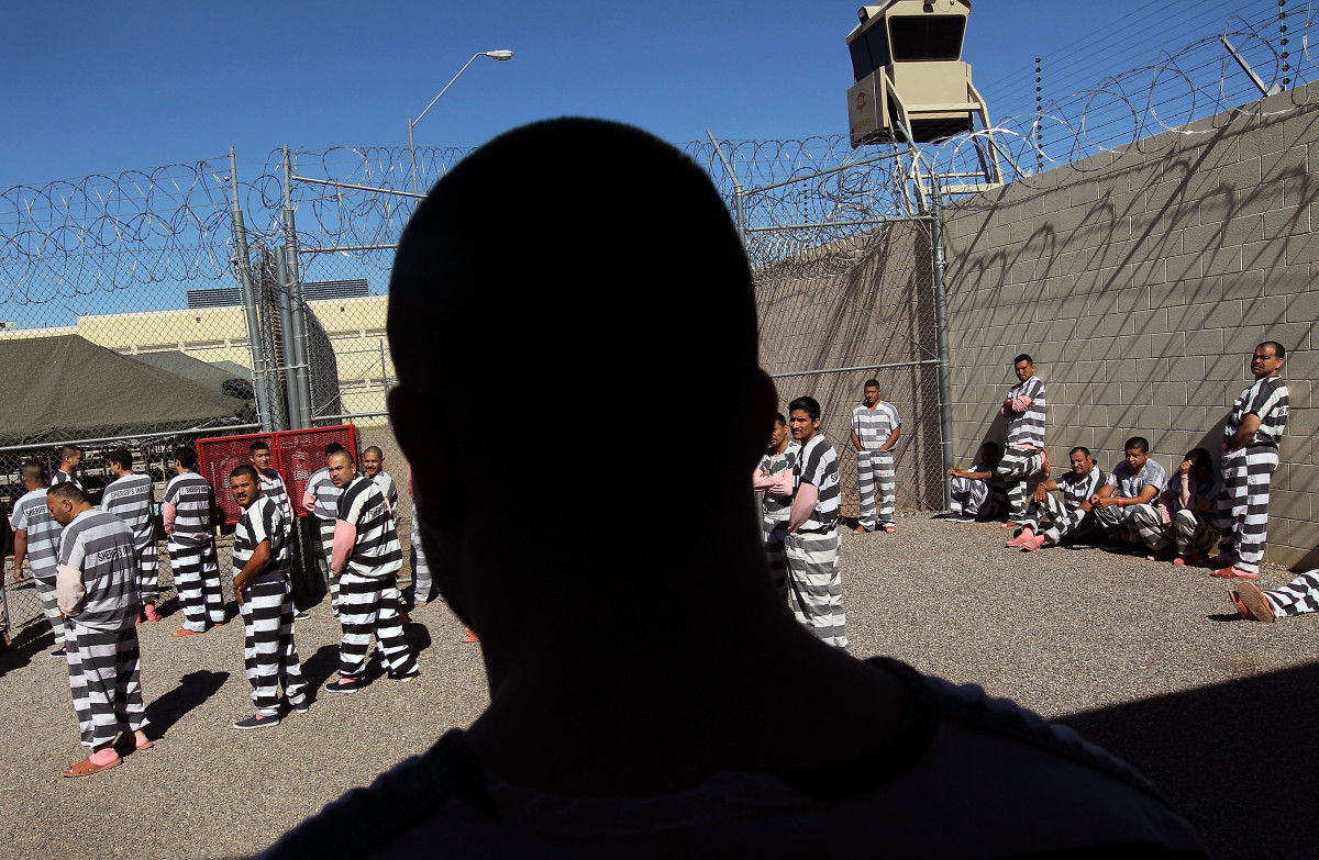 Undocumented immigrants gather in the Maricopa County "Tent City Jail," run by Sheriff Joe Arpaio, in Phoenix, Arizona, in 2010.