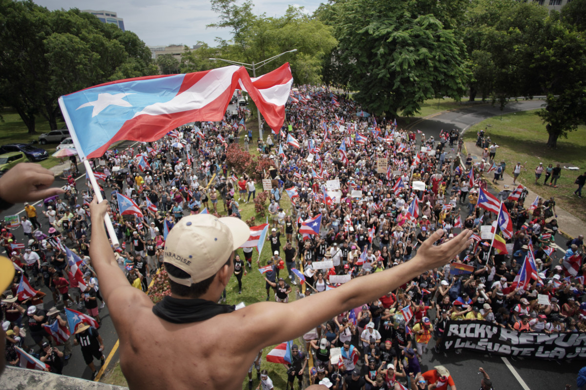 People march in San Juan on July 25th, 2019, one day after the resignation of Puerto Rico's Governor Ricardo Rosselló.