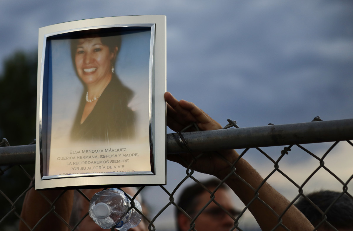 A photo of Elsa Mendoza Marquez, a Mexican schoolteacher who was the mother of two adult children, is displayed at an interfaith vigil for victims of a mass shooting, which left at least 20 people dead, including Marquez, on August 4th, 2019, in El Paso, Texas. At least 26 people were wounded.