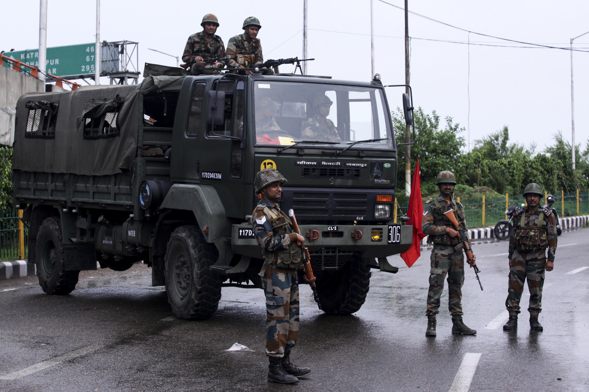 Security personnel stand guard on a street in the Indian state of Jammu and Kashmir on August 5th, 2019.